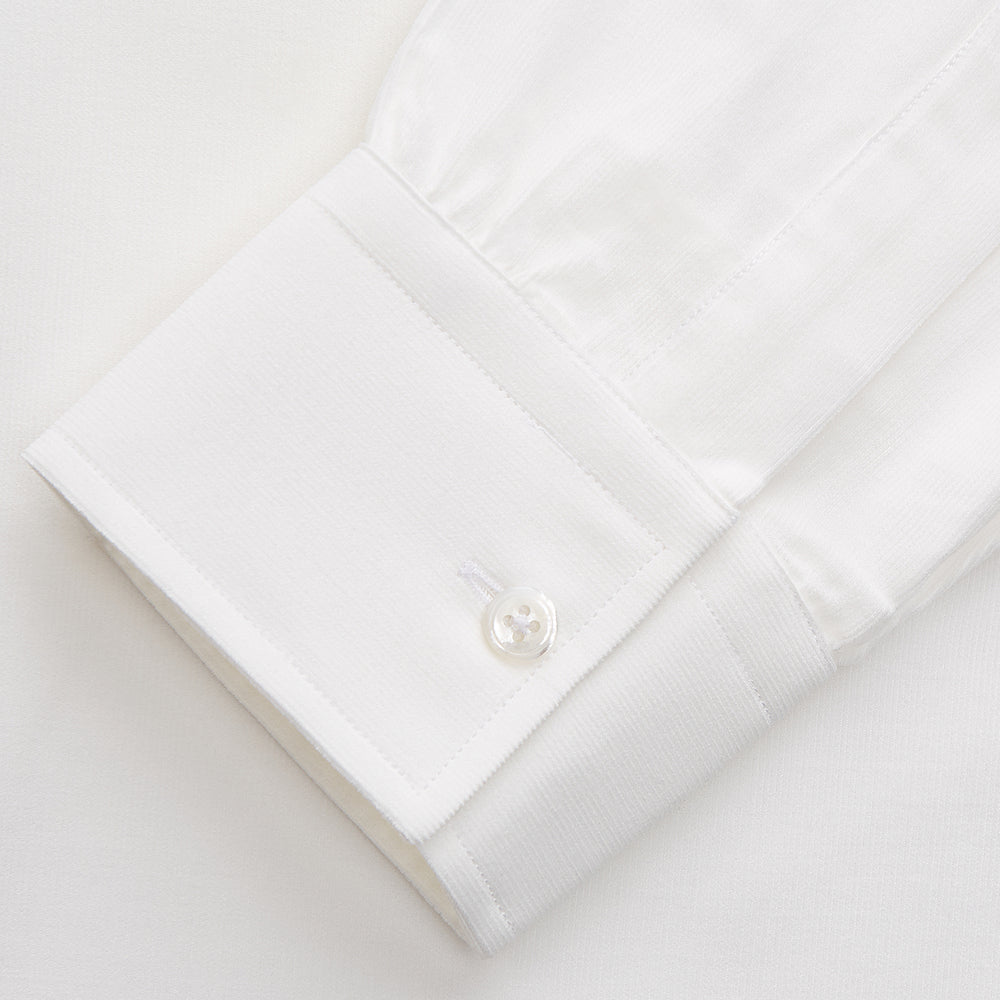 The White Cotton Weekend Fit Langston Shirt by Turnbull & Asser, with a Derby collar, long sleeves, and two button-flap chest pockets, is shown laid flat on a white background.