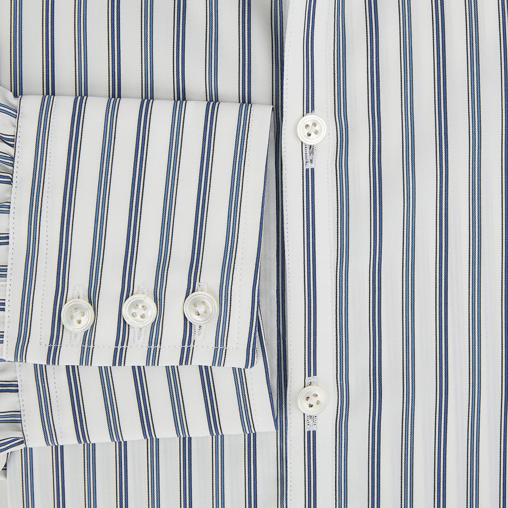 The SAPPHIRE BLUE MULTI TRACK STRIPE WINDSOR SHIRT by Turnbull & Asser features long sleeves, button-up front, classic collar, blue and white vertical stripes, buttoned cuffs, and showcases British craftsmanship on a white background.