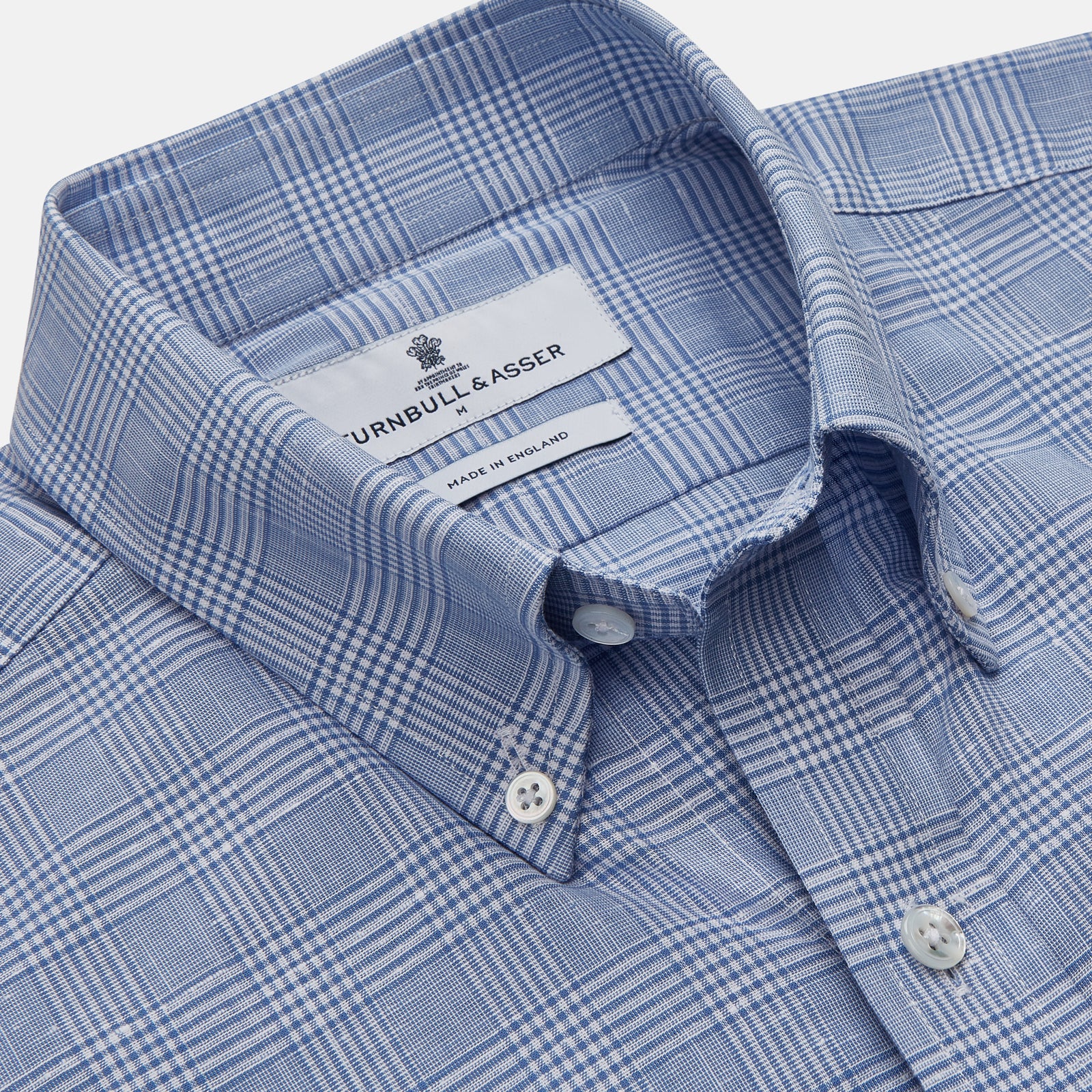 View 3 of product The Turnbull & Asser Pale Blue Multi Check Cotton Weekend Fit Williams Shirt features short sleeves, a pointed collar, single chest pocket, and premium Italian cotton with a subtle checkered pattern, shown on a white background.