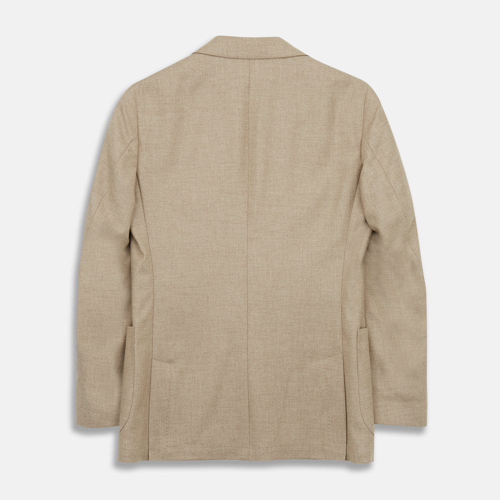 A man wearing the Beige Wool, Silk and Cashmere Bern Jacket by Turnbull & Asser over a matching shirt and olive green pants stands against a plain light gray background, looking to his left with a neutral expression.