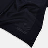 View 2 of product The Navy and Charcoal Stripe Silk Pocket Square by Turnbull & Asser features fine hand-rolled edges, thin white stripes on navy, and TURNBULL & ASSER HAND PRINTED IN ENGLAND in white on the corner.