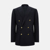 View 1 of product The Turnbull & Asser Navy Double Breasted Classic Blazer features gold buttons, peaked lapels, and multiple front pockets, exemplifying classic British tailoring against a plain light background.
