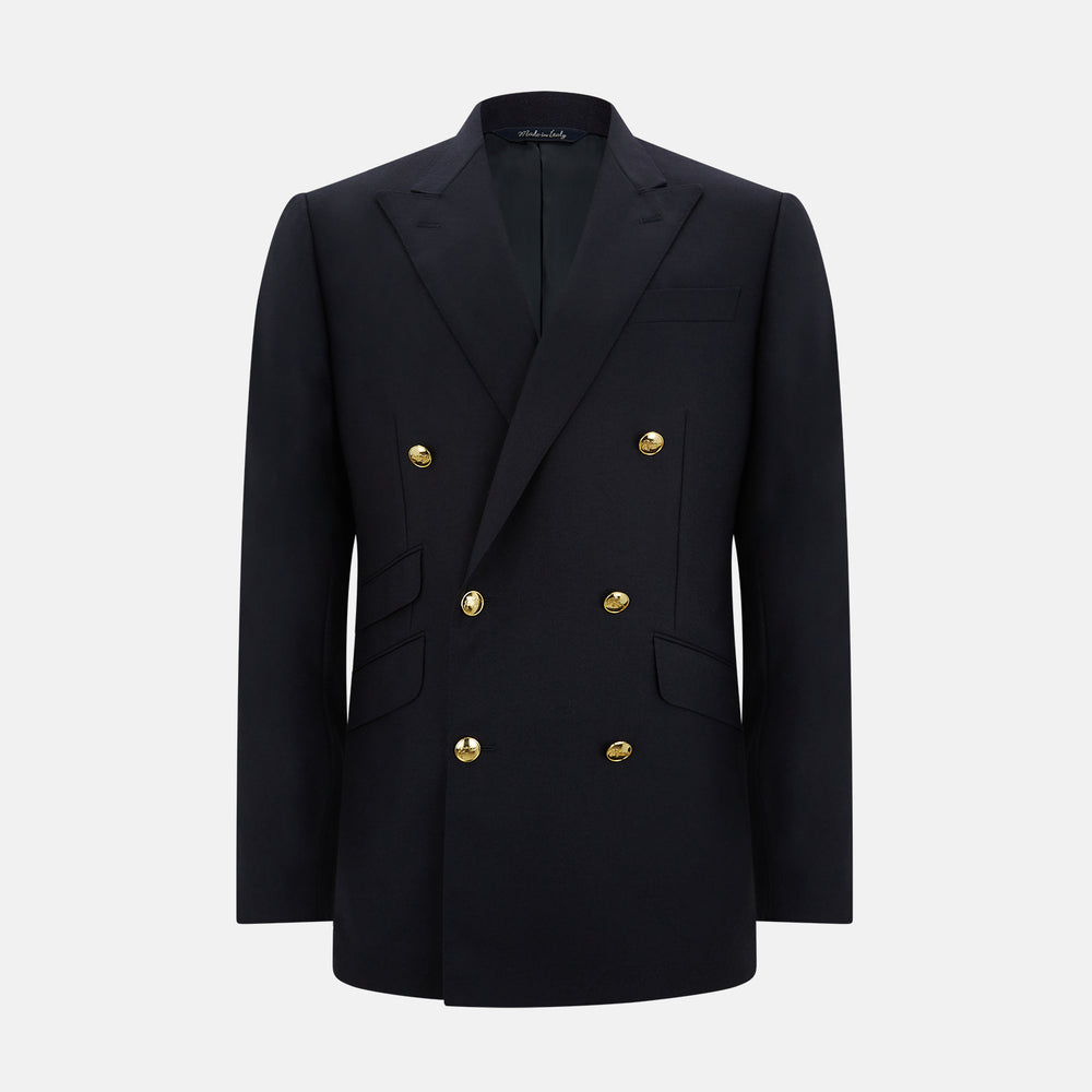 The Turnbull & Asser Navy Double Breasted Classic Blazer features gold buttons, peaked lapels, and multiple front pockets, exemplifying classic British tailoring against a plain light background.