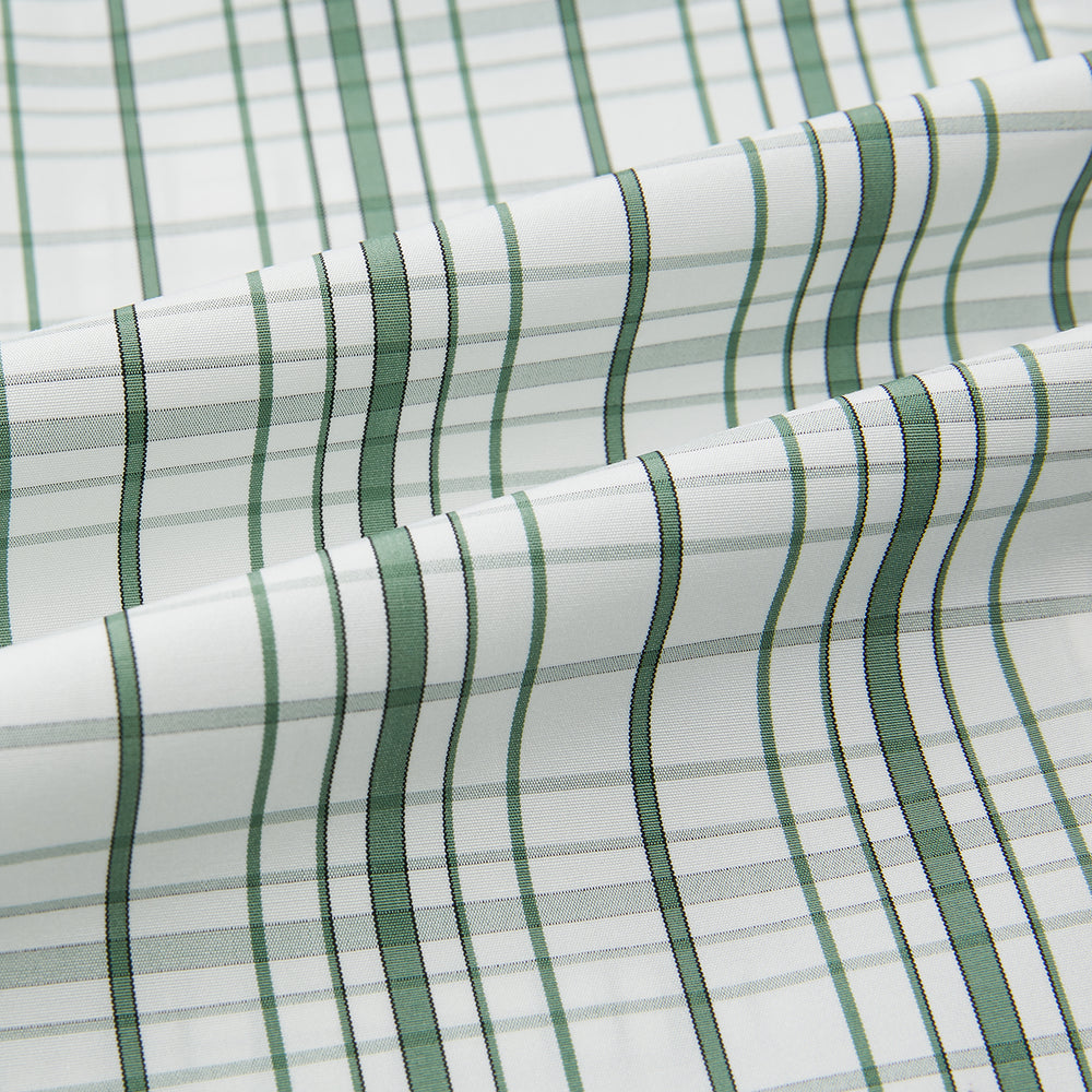 The Turnbull & Asser Sage Green Plaid Check Westminster Shirt features a collared, long-sleeve button-up design with a white base and sage green plaid pattern, showcasing classic British craftsmanship against a clean white background.