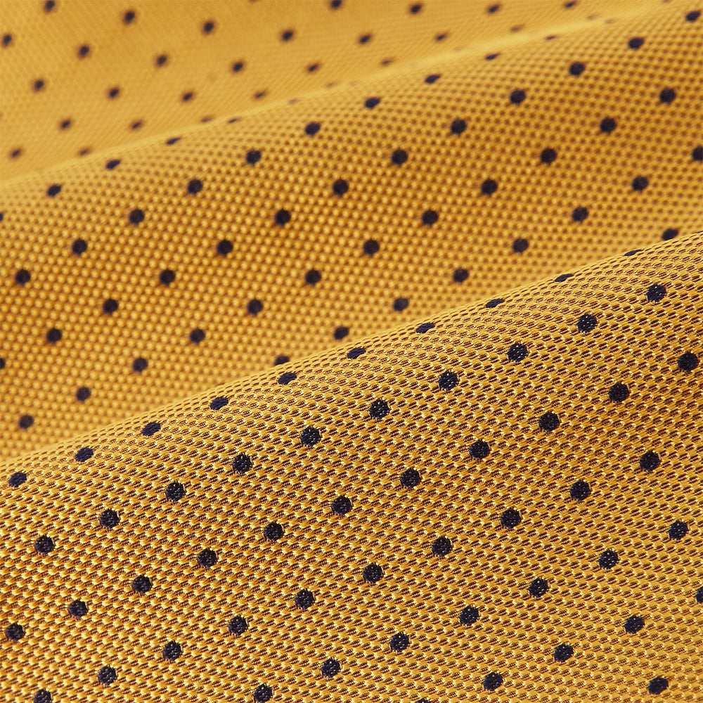 A refined formal accessory, the Turnbull & Asser Navy and Yellow Micro Dot Silk Cravat features a textured silk fabric with small yellow micro dots—perfectly complementing your pocket square for an elegant look.