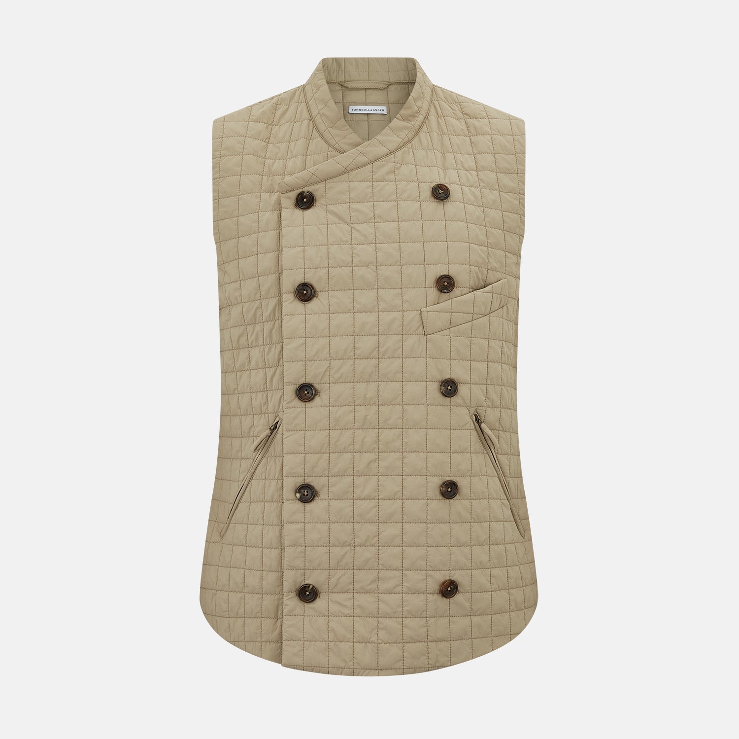 Image 1 of product The Turnbull & Asser Sand Double-Breasted Quilted Gilet features a sleeveless design, brown buttons, slanted chest pocket, and two zippered side pockets—perfect for modern layered dressing. Shown on a plain white background.