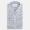 View 5 of product The Navy and White Ticking Stripe Mayfair Shirt by Turnbull & Asser features long sleeves, buttoned cuffs, a pointed T&A collar, and button-up front, shown on a plain white background.