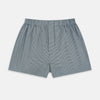 View 1 of product Turnbull & Asser Green Houndstooth Godfrey Boxer Shorts with an elastic waistband, showcasing a small black and white houndstooth pattern, are laid flat on a white background.
