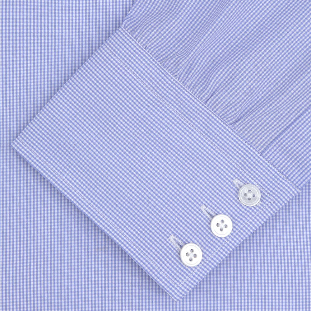 Turnbull & Asser's Blue Fine Check Sea Island Quality Cotton Shirt features a T&A collar, 3-button cuffs, and white buttons, all neatly folded and displayed on a plain white background.