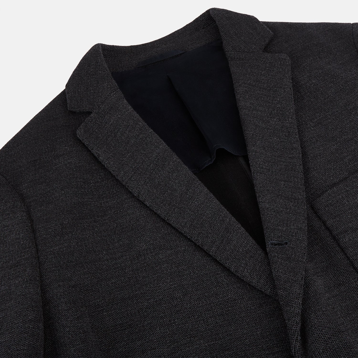 Image 2 of product The Turnbull & Asser Charcoal Knitted Oxford Blazer features a notched lapel, two-button closure, and three front pockets, blending modern elegance with British heritage against a plain white background.
