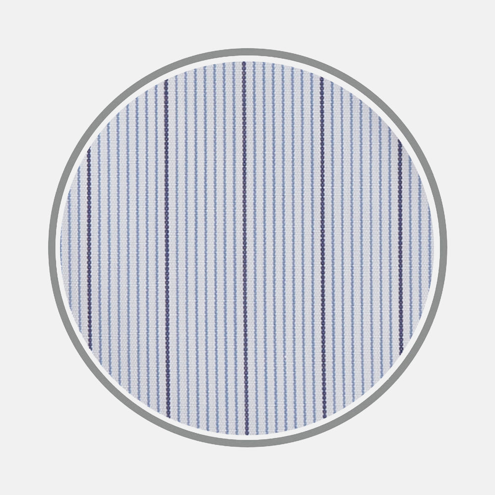 Close-up of Turnbull & Asser Blue and Navy Fine Stripe Cotton Fabric, showcasing alternating thin and thick navy stripes on light blue cotton, displayed within a circular frame on a white background.