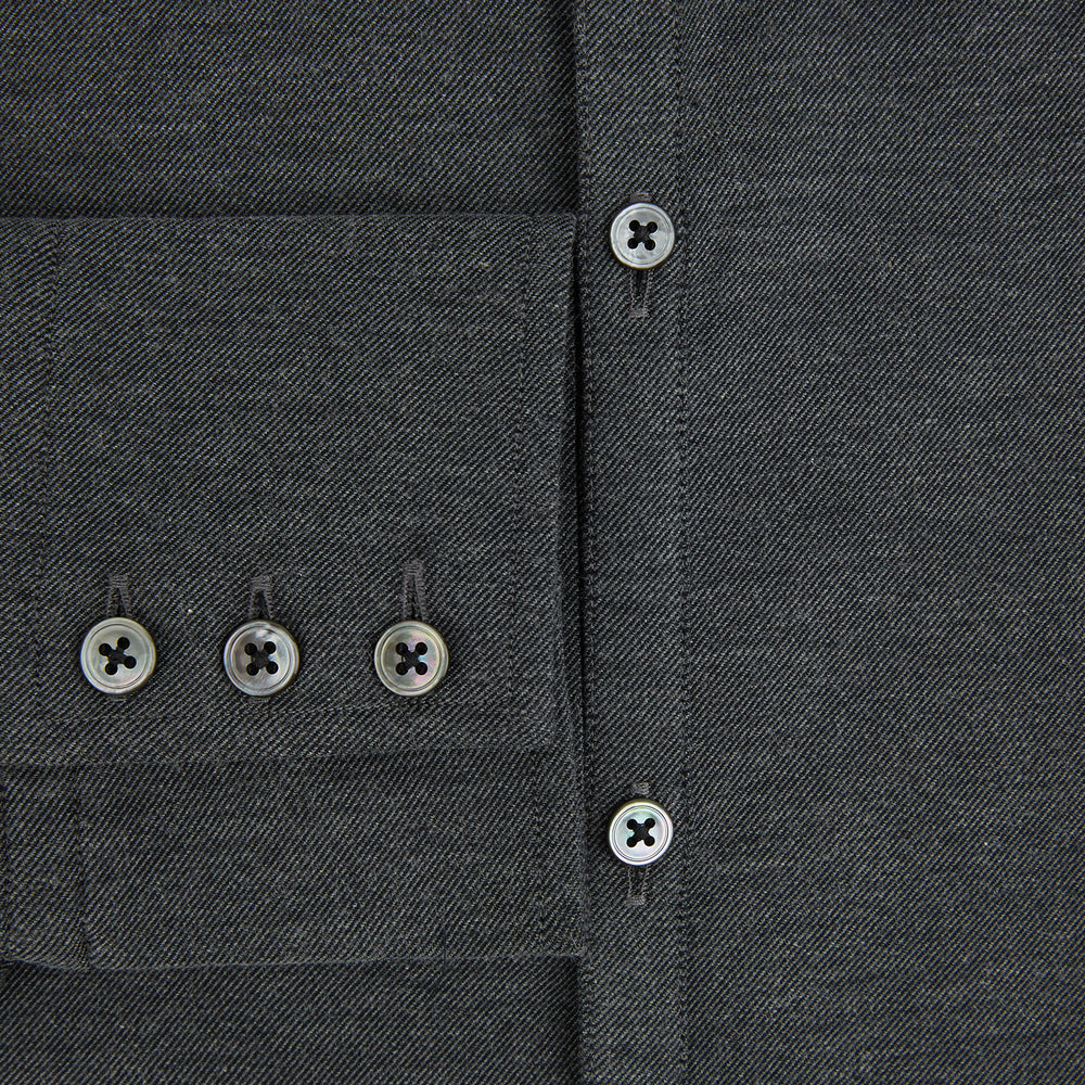 The Charcoal Melange Westminster Shirt by Turnbull & Asser features a long-sleeve, button-up design with a Turnbull collar and buttoned cuffs, offering classic British craftsmanship in a timeless style.