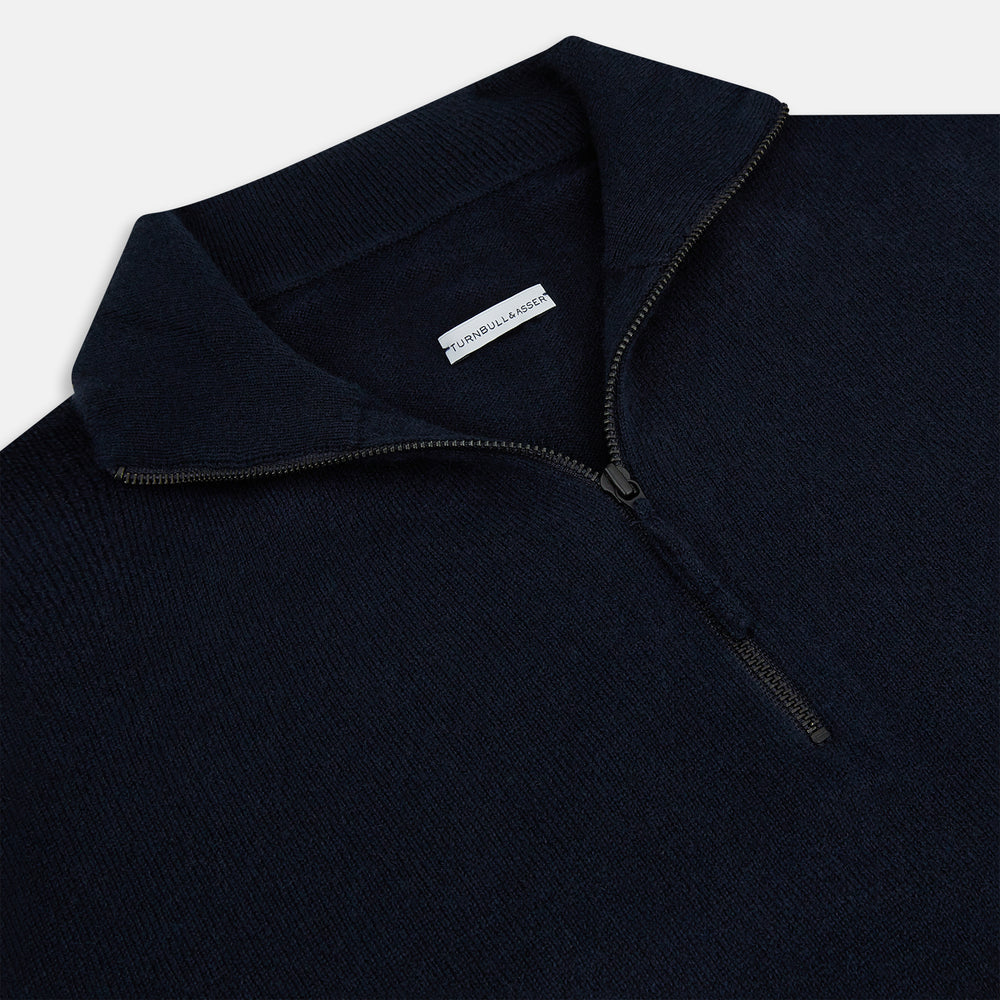 The Midnight Blue Half-Zip Cashmere Jumper by Turnbull & Asser features a stand collar, long sleeves, and quarter-zip closure, crafted from premium cashmere and shown against a plain white background.