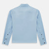 View 3 of product The Blue Hyde Overshirt by Turnbull & Asser features a light blue hue, long sleeves, a button-up front, and a single chest pocket. Crafted from sanforised cotton and shown laid flat on a white background.