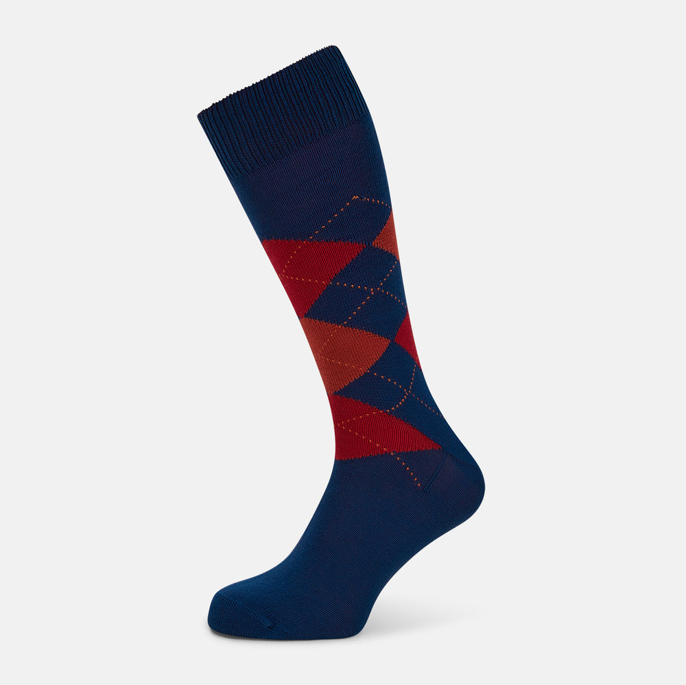 Turnbull & Asser’s Royal Blue Check Mid-Length Sock features a blue base with red, orange, and blue checks on the calf, shown against a plain white background.