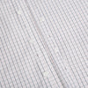 View 8 of product The Blue and Red Graph Check Westminster Shirt by Turnbull & Asser features a classic collar, long sleeves, and British craftsmanship, with a blue and red checkered pattern on white, displayed flat on a white surface.