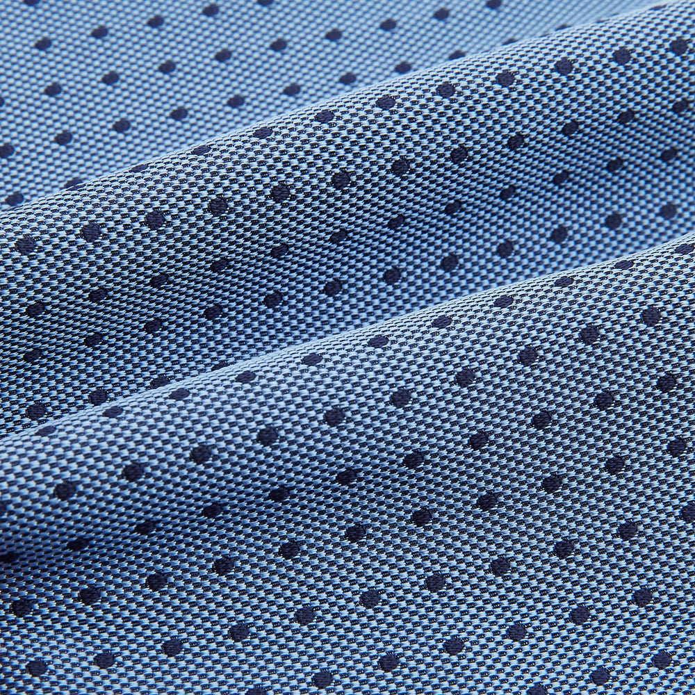The Turnbull & Asser Navy and Blue Micro Dot Silk Cravat, featuring a refined dot pattern, makes an elegant statement when paired with a matching pocket square, showcased here against a white background.