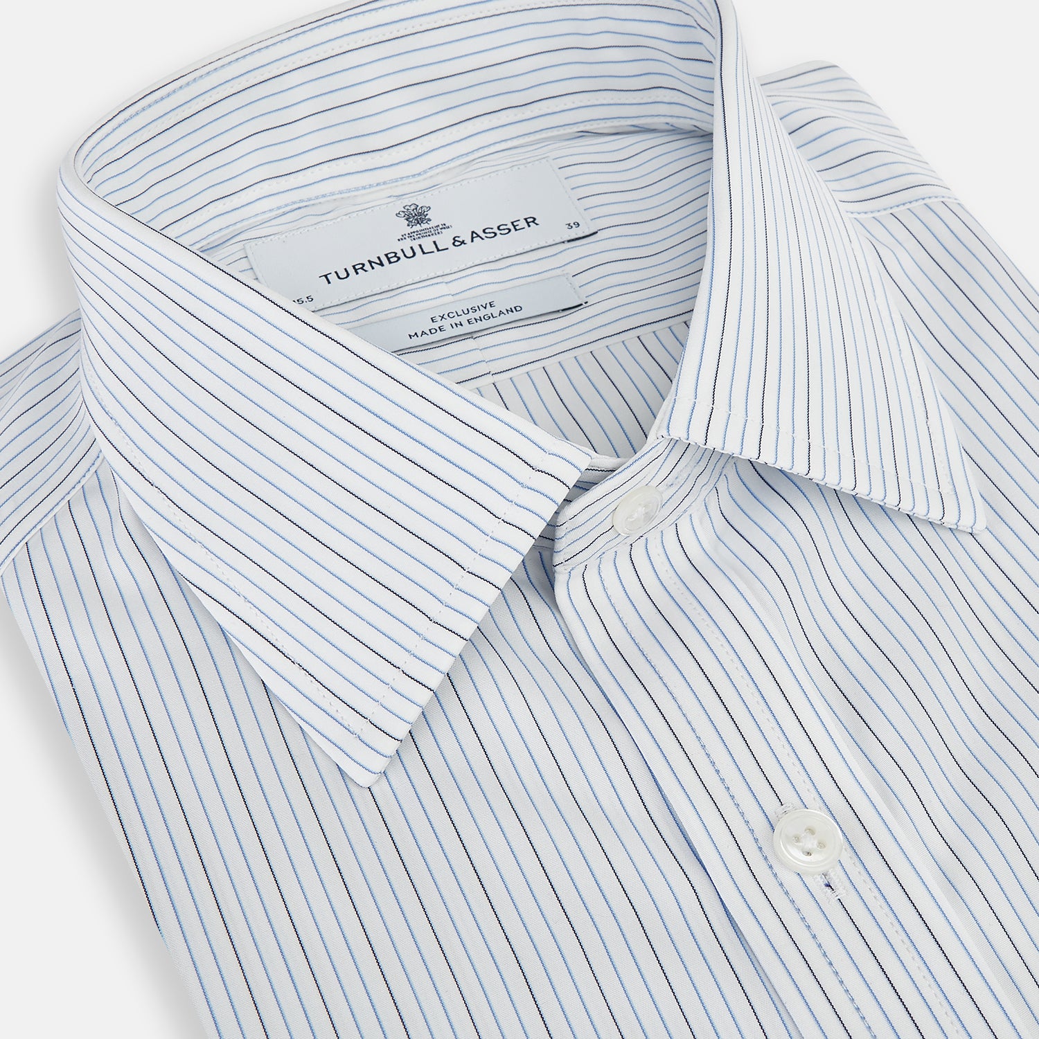 View 2 of product The Navy and Blue Pinstripe Mayfair Shirt by Turnbull & Asser, featuring a classic collar and crafted from premium Italian cotton, is shown against a white background.