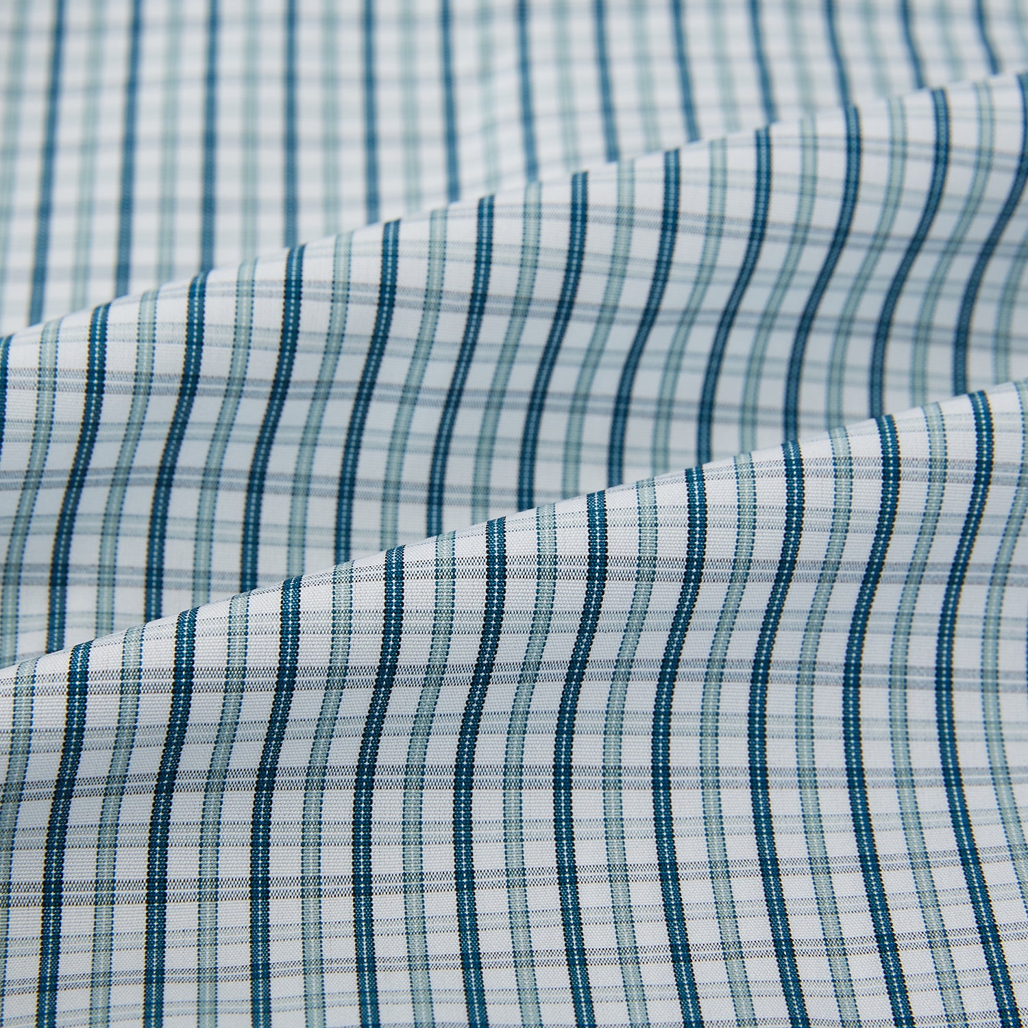 View 6 of product The Turnbull & Asser Light Petrol Micro Tattersall Check Mayfair Shirt features long sleeves, a classic collar, buttoned cuffs, and is crafted from Italian cotton in a refined blue and white check pattern.