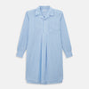 View 1 of product The Turnbull & Asser White and Blue Stripe Quarzo Nightshirt features long sleeves, a collar, button-up front, chest pocket, and mid-length hem—a classic men's striped sleepwear piece.