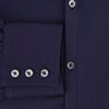 View 4 of product The Navy Textured Windsor Shirt by Turnbull & Asser features long sleeves, a Windsor collar, buttoned cuffs, and white buttons—a fine example of British craftsmanship—set against a plain white background.