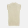 View 3 of product Turnbull & Asser’s Ivory Cashmere Sleeveless Cardigan features a button-down front, two small pockets, and ribbed trim at the hem, armholes, and collar—ideal for elegant looks. Shown on a white background.