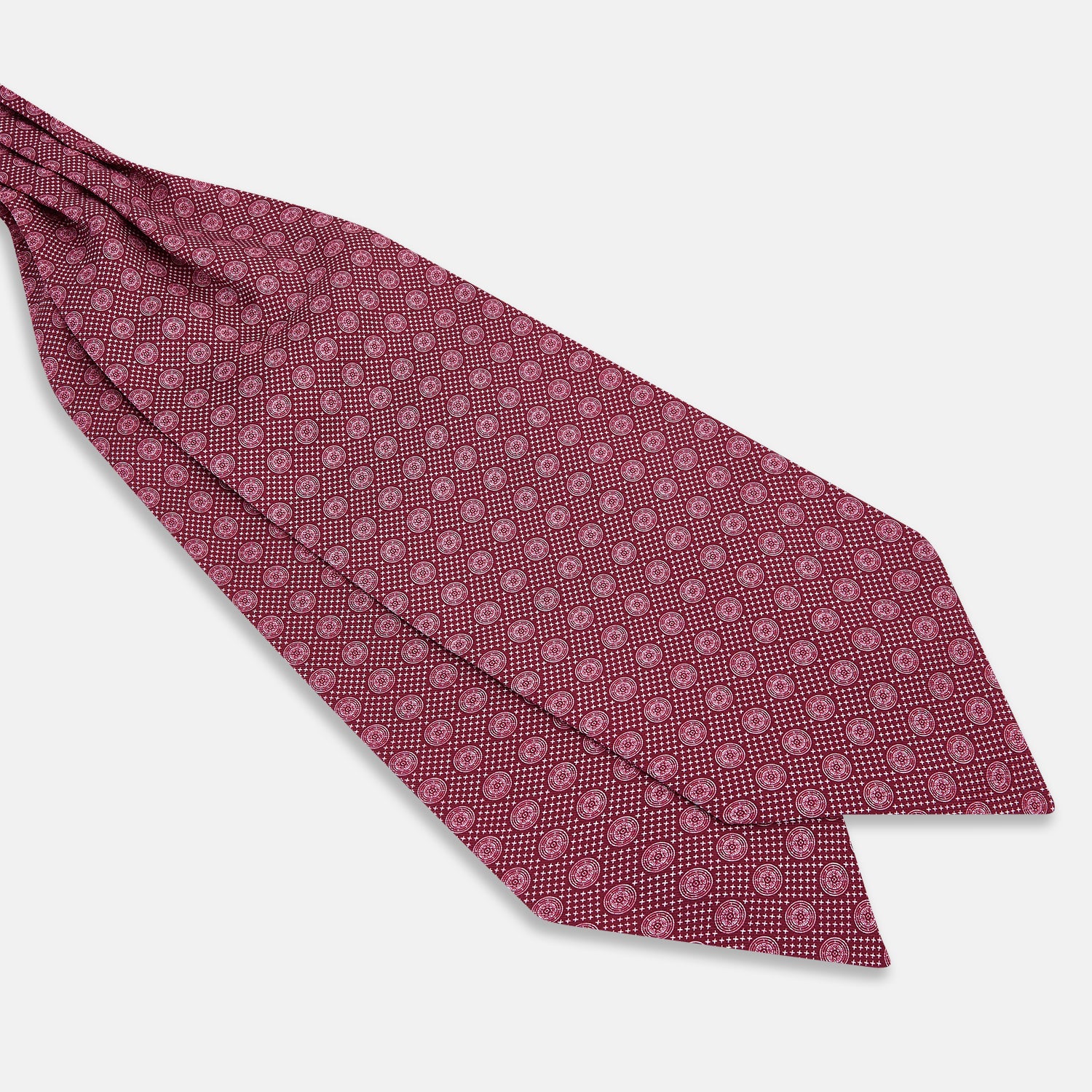 View 3 of product The Burgundy Medallion Silk Cravat by Turnbull & Asser features a white geometric medallion pattern, neatly crafted for an elegant accessory inspired by classic British style.