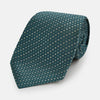 View 1 of product The Turnbull & Asser Teal Micro Hexagon Silk Tie showcases a textured geometric dot and subtle hexagon pattern, adding a refined touch to any tailored look.
