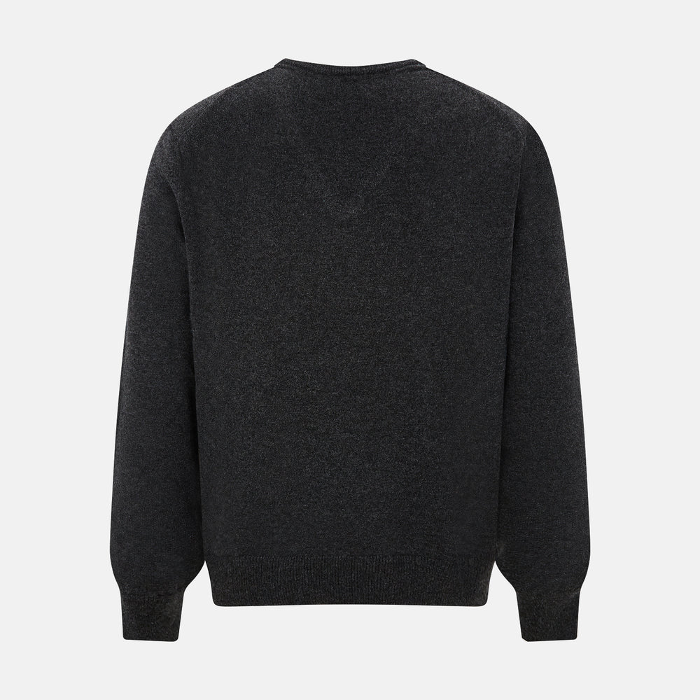 The Turnbull & Asser Charcoal Grey Melange V-Neck Cashmere Jumper is shown on a white background, featuring long sleeves, ribbed cuffs and hem for classic style and comfort.