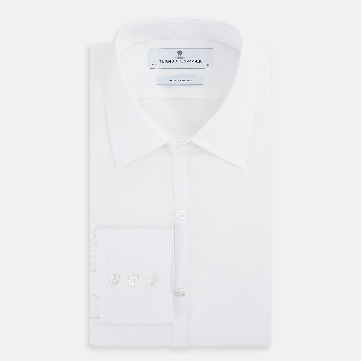 View 5 of product The Turnbull & Asser White Westminster Shirt is a long-sleeve, button-up dress shirt with a classic cut and Westminster collar, shown on a white background.