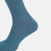 View 4 of product The Azzurro Organic Cotton Mid-Length Sock by Turnbull & Asser, featuring a ribbed texture in blue, is displayed against a plain white background.
