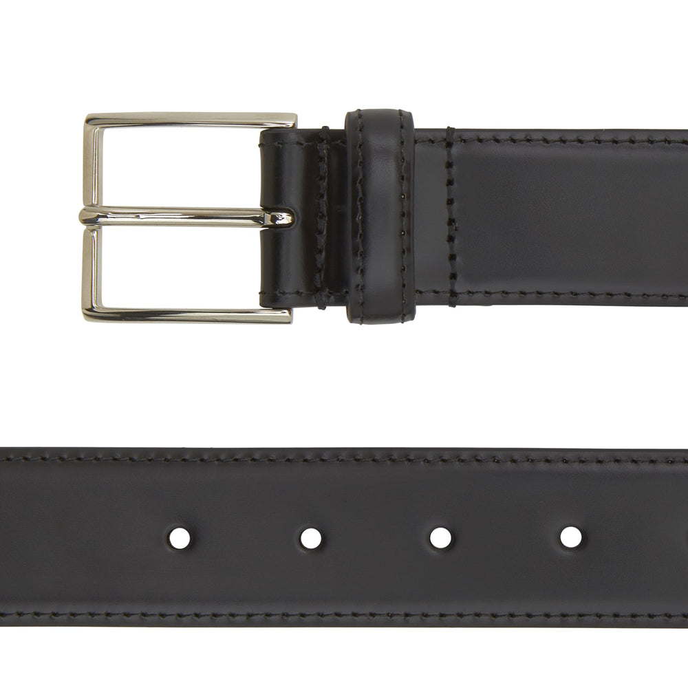 The Turnbull & Asser Black Nubuck Leather Evening Belt features a coiled design, silver rectangular buckle, and tan interior, elegantly displayed against a plain white background.