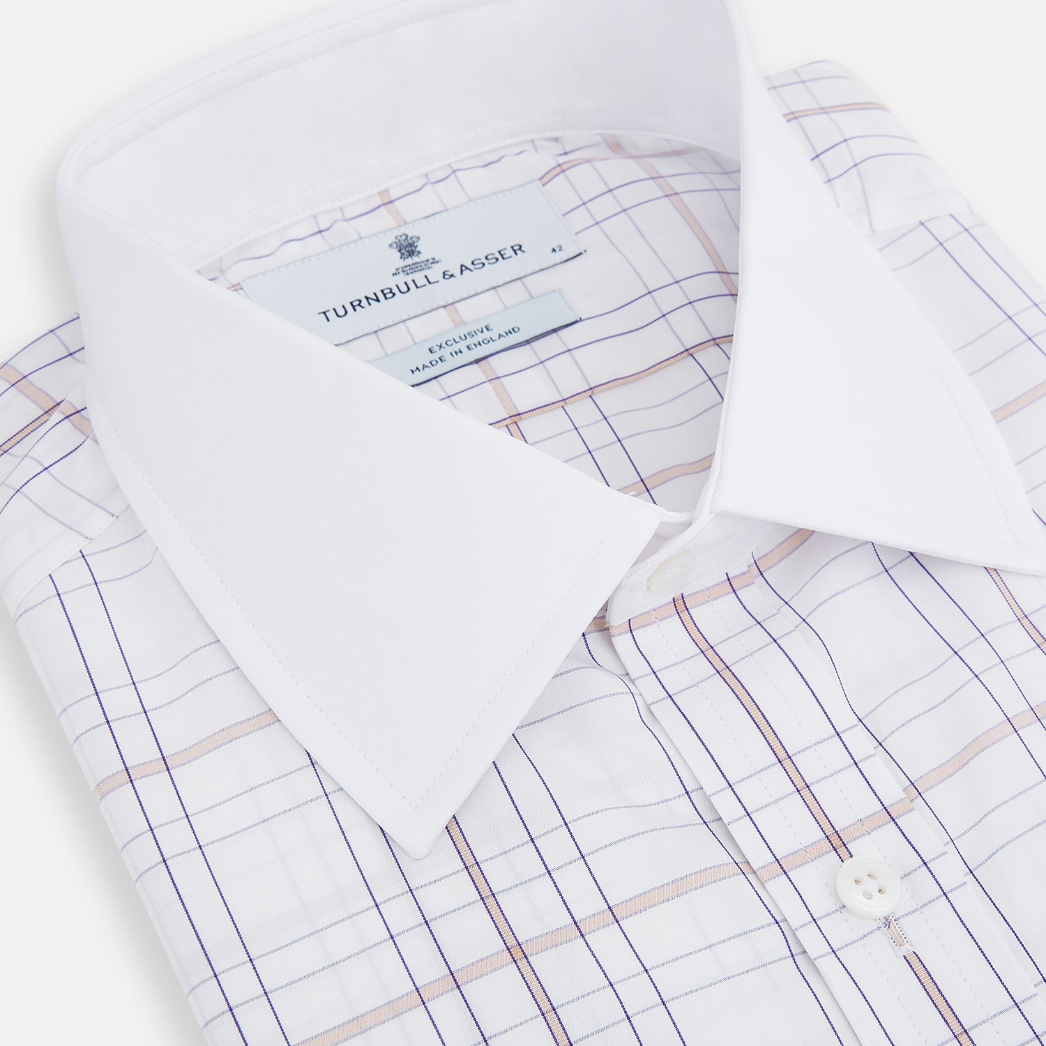 View 13 of product The Turnbull & Asser Purple Multi Plaid Check Shirt features a spread collar, double cuffs, and a fitted silhouette. Its bold plaid pattern and contrast collar add a modern touch to classic British style. Displayed on a plain white background.