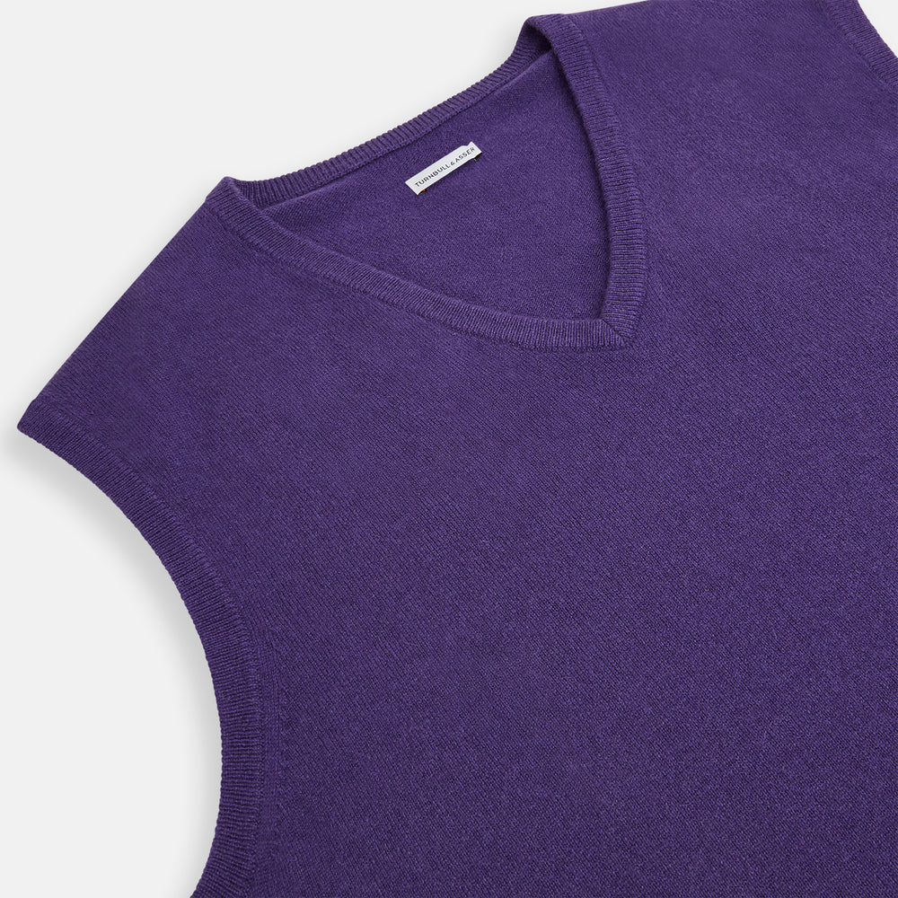 The Turnbull & Asser Purple Cashmere V-Neck Vest for men is shown against a white background. Featuring a ribbed hem and clean lines, this sleeveless jumper is ideal for layering in cooler weather.