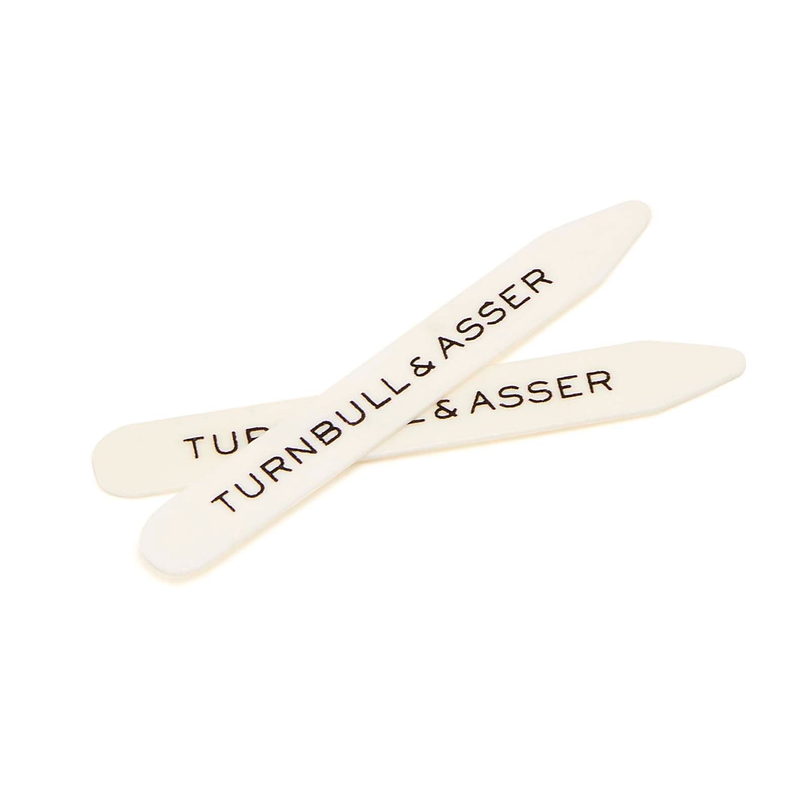 View 2 of product The Turnbull & Asser Bone Collar Stays come in a black leather case lined with red suede, holding six white bone stays—four short, two long—to keep your shirt collars crisp and perfectly stiff.