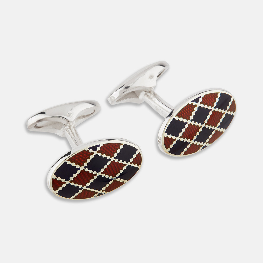 Displayed on a white background, the Turnbull & Asser Burgundy and Navy Checkered Oval Enamel Cufflinks capture masculine elegance with their geometric enamel design.