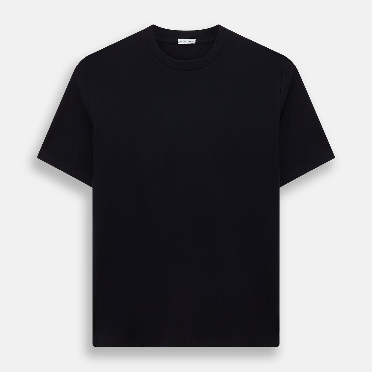 View 1 of product A navy short-sleeve pyjama shirt by Turnbull & Asser is laid flat on a white background, displaying the front view. Its soft fabric ensures comfort with no visible logos, designs, or patterns on the shirt.