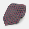 View 1 of product The Turnbull & Asser Burgundy and Navy Weave-Patterned Printed Silk Tie features an intricate geometric design, shown rolled on a plain white background.