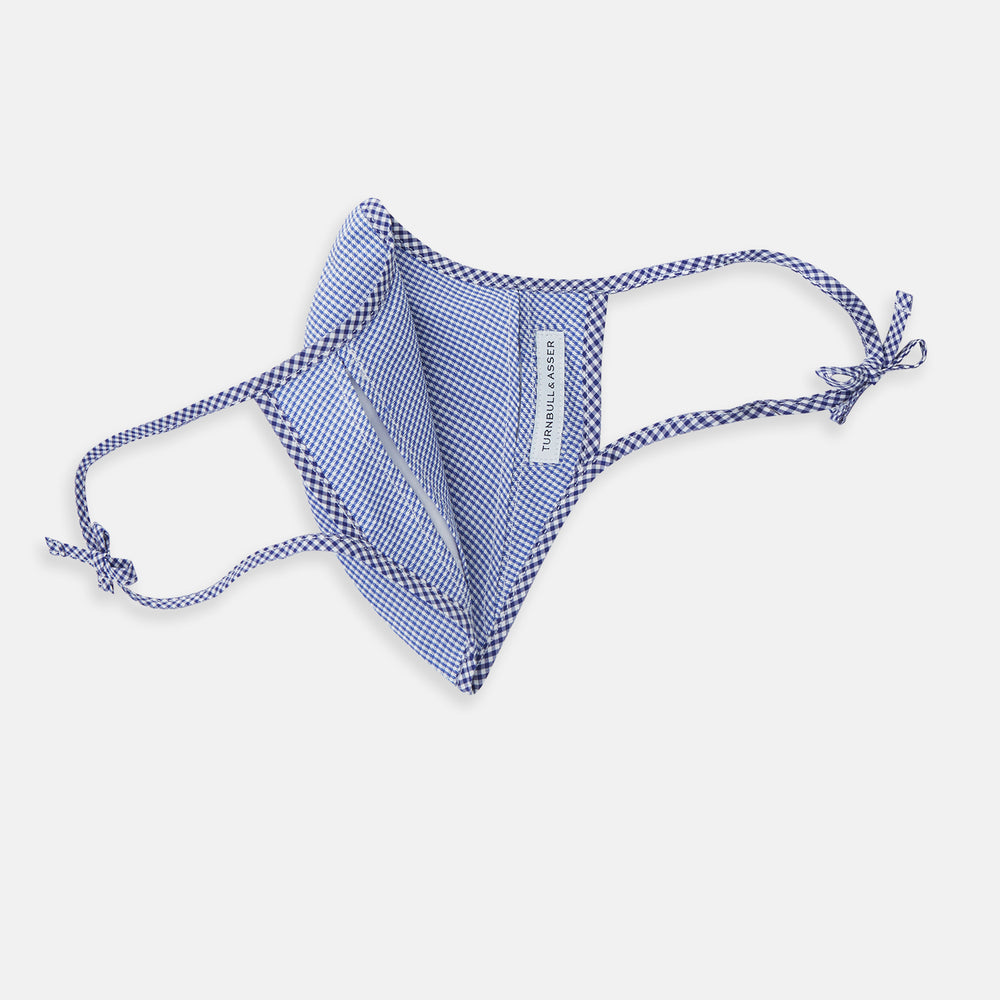 The Turnbull & Asser White & Navy Multi Check Commuter Mask comes with 3 Viroformula™ filters and two adjustable tie straps on each side, shown on a plain white background.