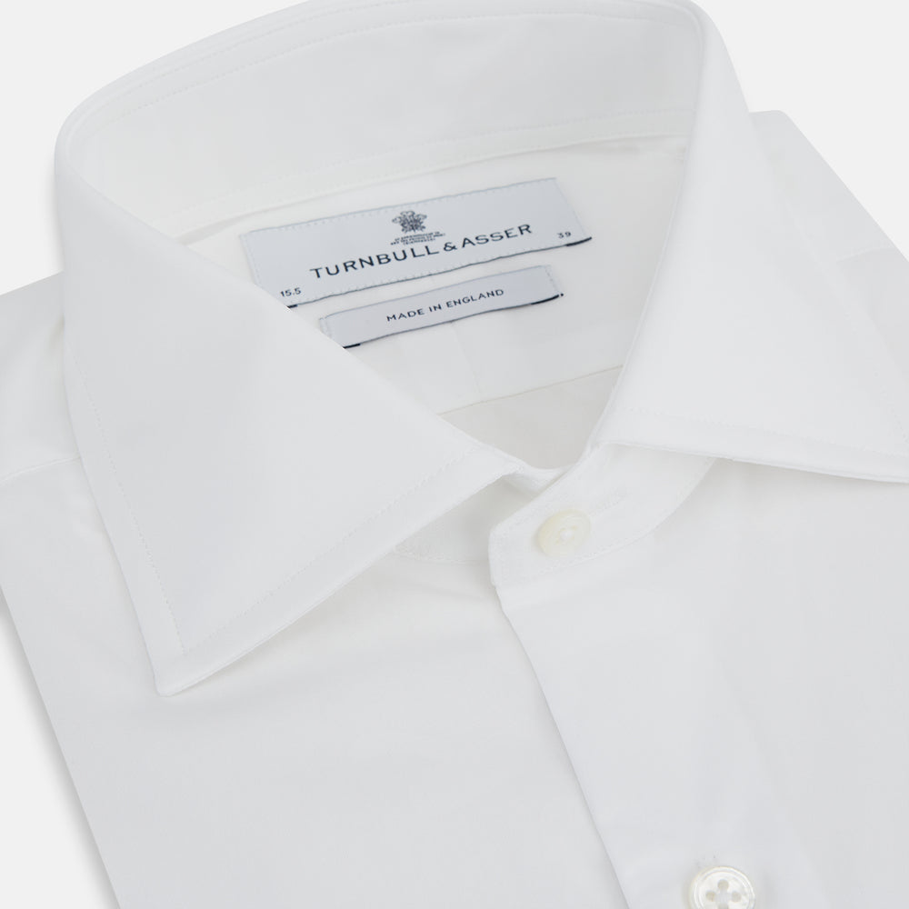 The Turnbull & Asser Tailored Fit Plain White Cotton Shirt features a classic kent collar and 3-button cuffs, displayed against a white background.