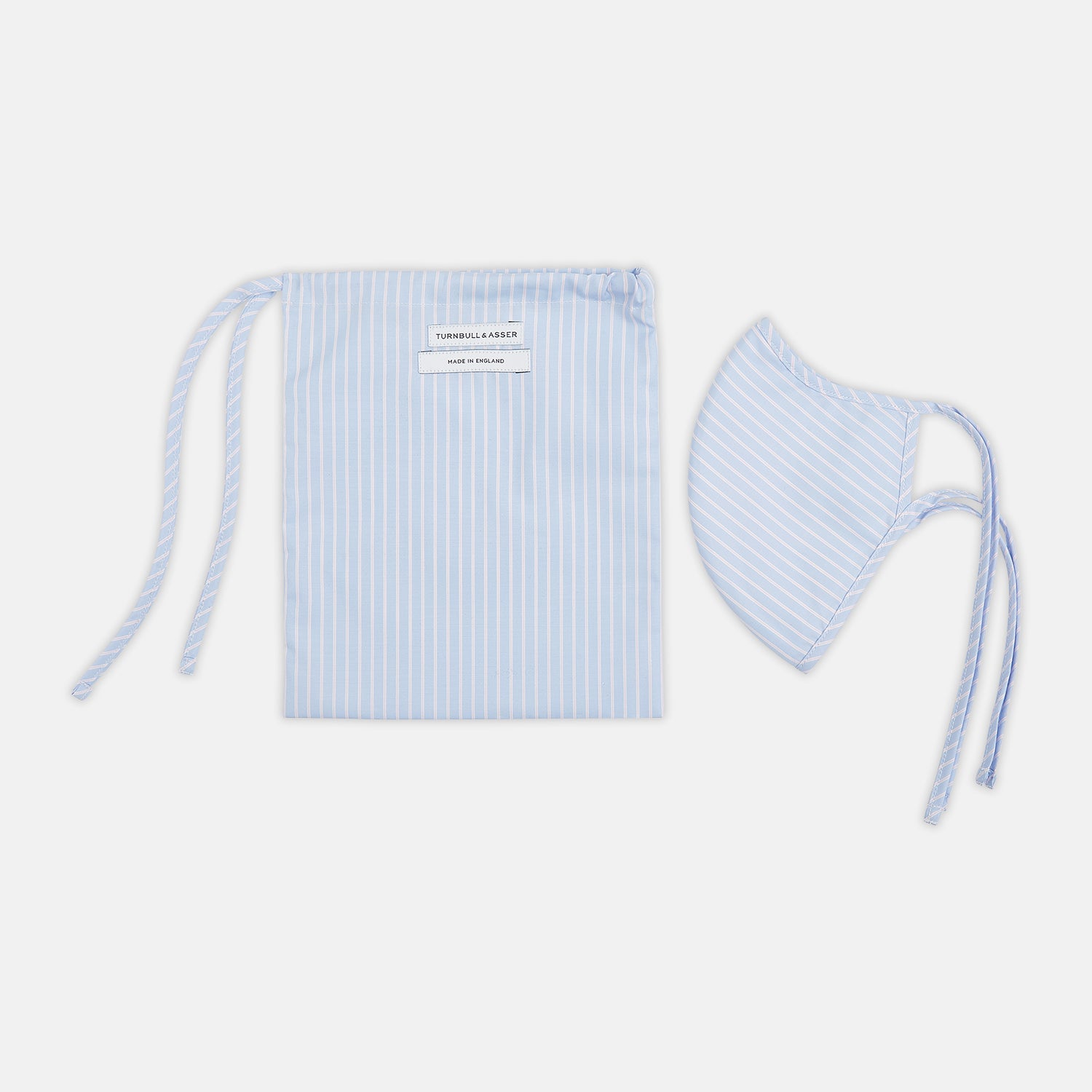 View 2 of product Turnbull & Asser's Exclusive Light Blue, White & Pink Stripe Commuter Mask features ear loops tied in bows and includes 3 VIROFORMULA™ filters for enhanced protection and comfort.