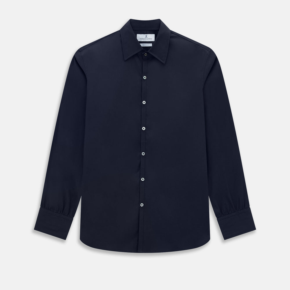 The Navy Westminster Shirt by Turnbull & Asser is a classic long-sleeve, button-up shirt with a pointed collar and buttoned cuffs, exemplifying British craftsmanship, shown against a plain white background.