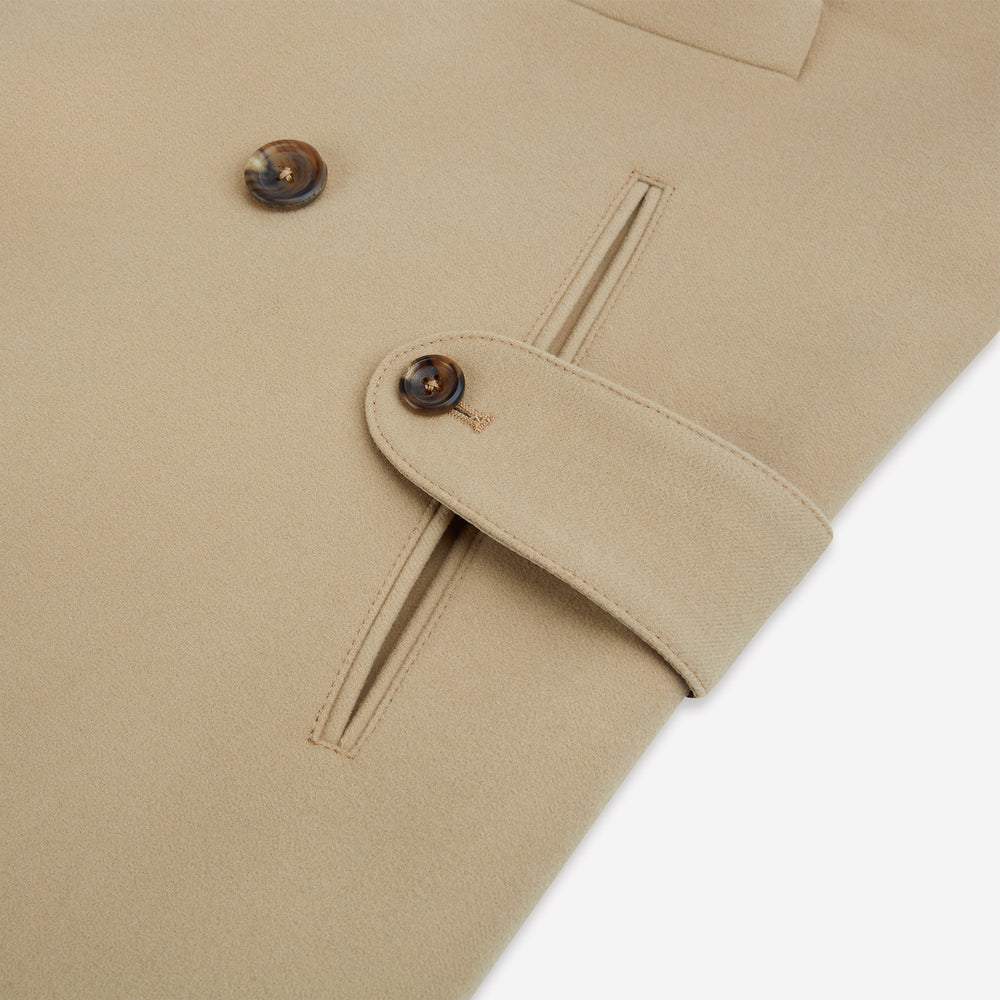 The Camel Wellington Double-Breasted Caban Coat by Turnbull & Asser features wide lapels, dark buttons, front flap and chest pockets, plus buttoned cuffs—perfect for elevating your formal wear collection.