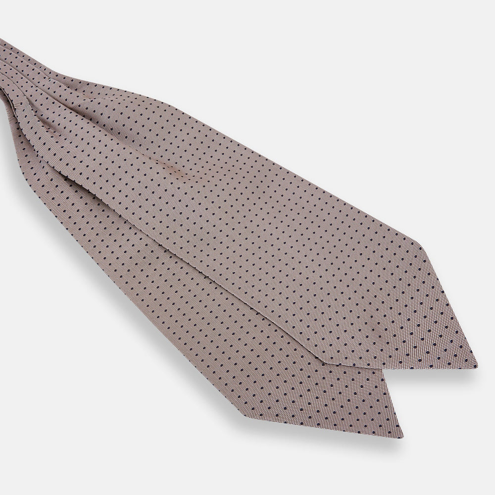 The Turnbull & Asser Navy and Lilac Micro Dot Silk Cravat features a refined pattern, making it perfect for pairing with pocket squares or to elevate any dress code with its sophisticated handmade style.