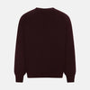 View 3 of product The Turnbull & Asser Burgundy Fine Merino V-Neck Cardigan features long sleeves and a button-down front, highlighting elegant handcrafted knitwear against a plain white background.