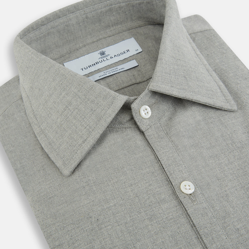 The Grey Westminster Shirt by Turnbull & Asser features a classic collar and white buttons, expertly crafted in Britain. This long-sleeve button-up is shown against a plain white background.