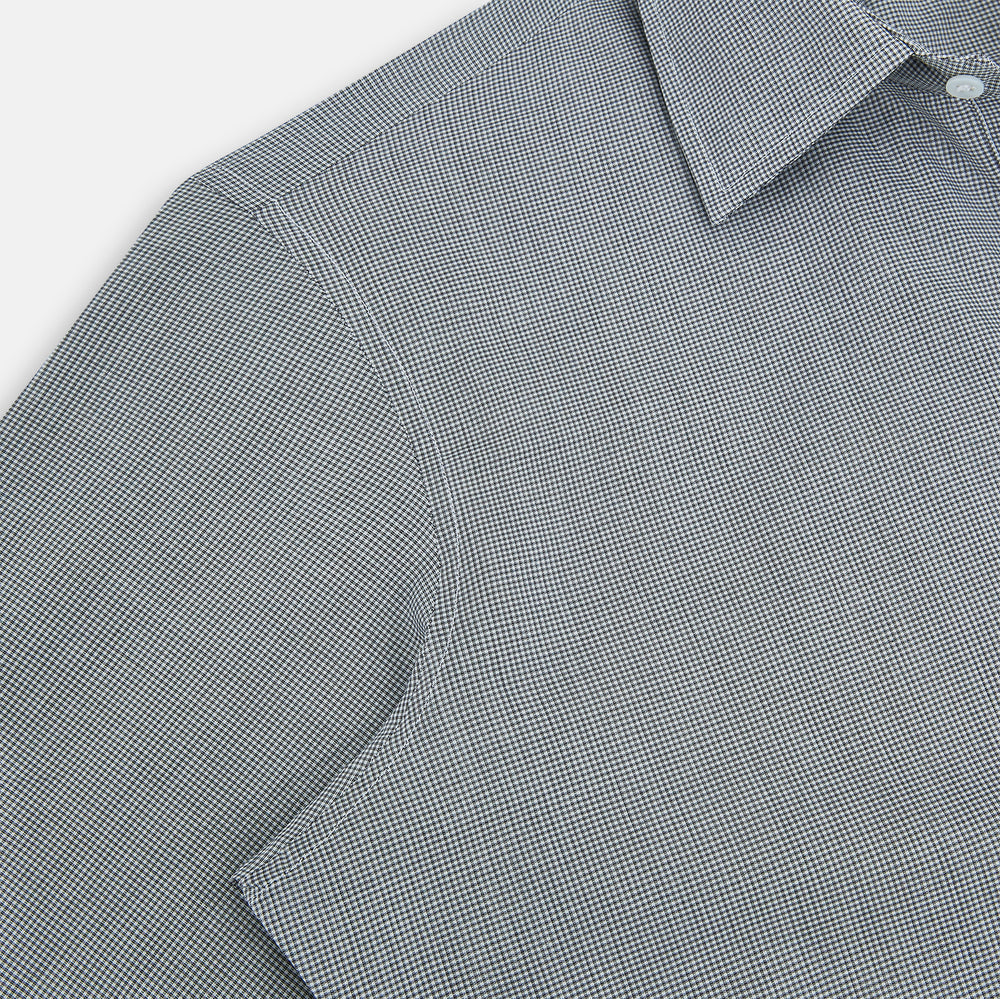 The Turnbull & Asser Grey and White Micro Check Westminster Shirt features long sleeves, a button-up front, a Westminster collar, and white buttons, shown flat on a white background.