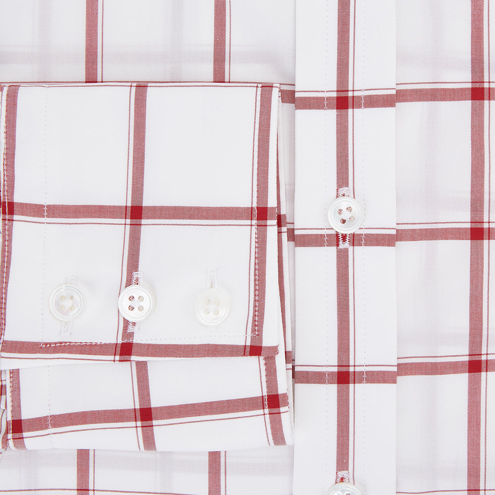 The Turnbull & Asser Dark Red Grid Check Mayfair Shirt is a long-sleeve white shirt made from Italian cotton, featuring a bold dark red grid pattern, button-down front, and classic collar, shown laid flat on a white background.
