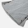 View 5 of product The Turnbull & Asser Grey Check Hampstead Overshirt features a light gray check pattern, pointed collar, chest pocket, and two zippered side pockets, displayed flat against a white background.