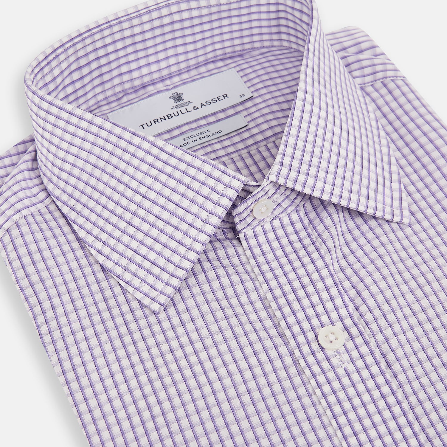 View 2 of product The Turnbull & Asser Purple Micro Shadow Check Mayfair Shirt features long sleeves, a classic collar, white buttons, and a subtle blue and white check pattern—perfect for formal wear and shown on a plain white background.